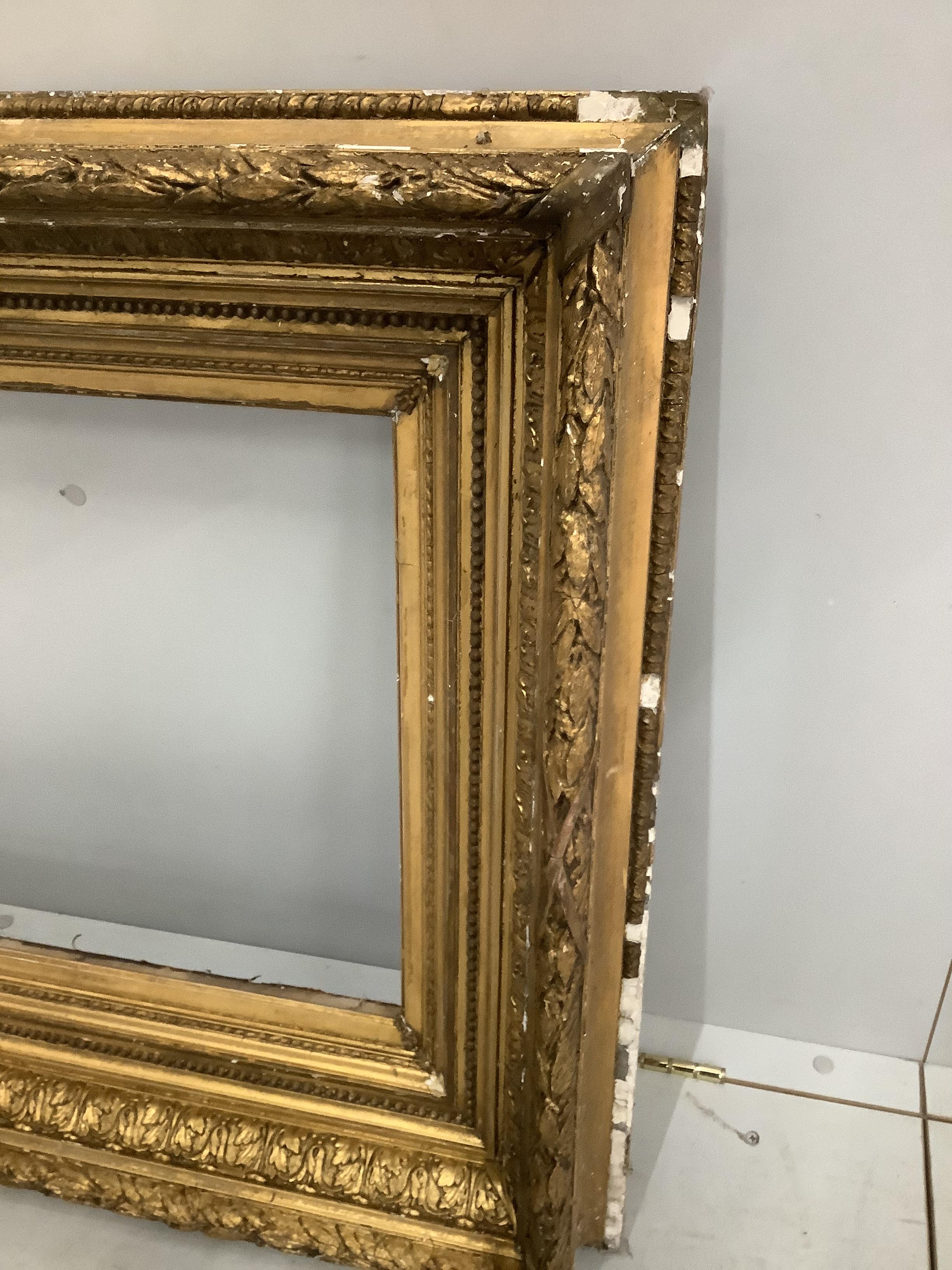 A Victorian rectangular giltwood and composition picture frame, width 73cm, height 105cm